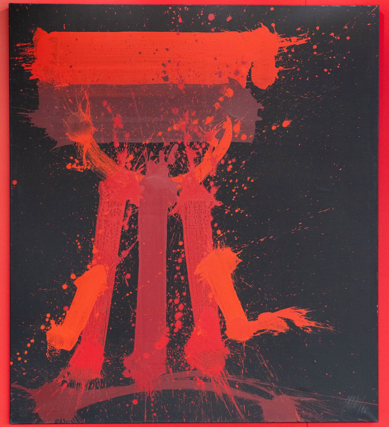 Quadro con sfondo nero con schizzi di varie tonalità di rosso